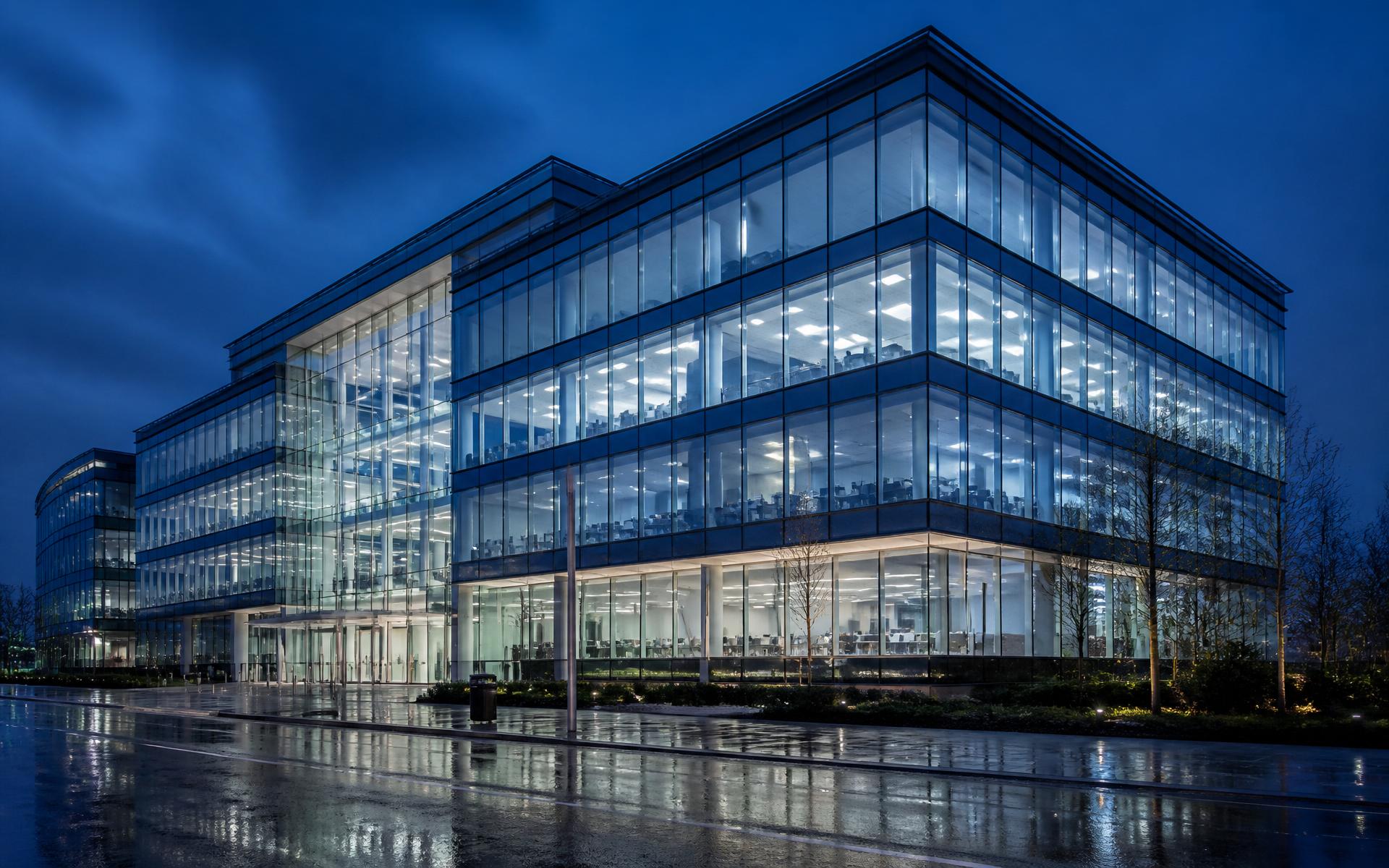 Modern glass façade at blue hour